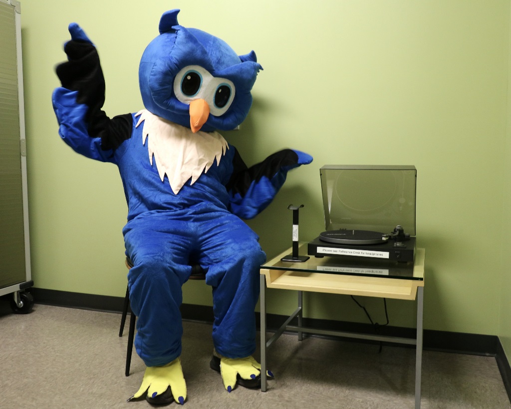 Whooo Mascot in Vinyl Room WFPL Whooo owl mascot sits in Vinyl Listening Room at the Pensacola Library